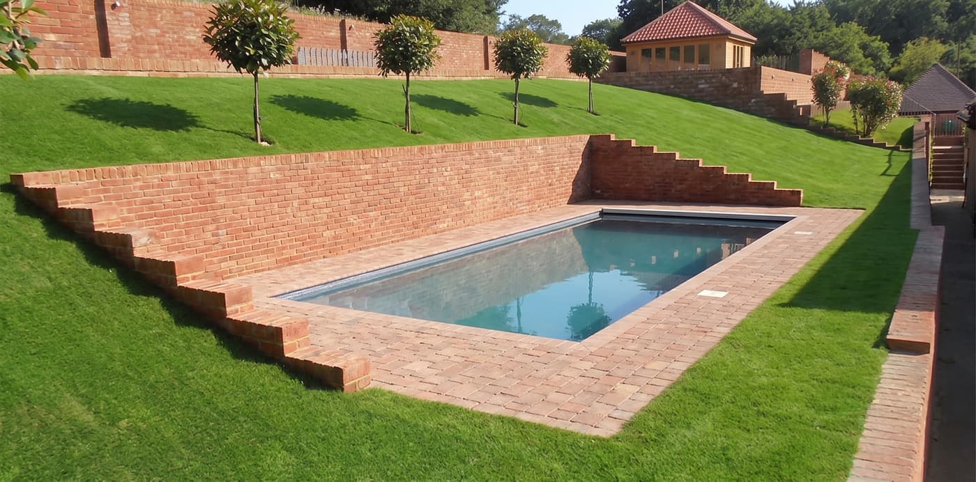 A hillside pool design with a retaining wall, AI visualization